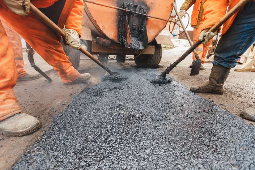 Commercial pothole repair on a road in Frederick, MD by Driveway 2Day