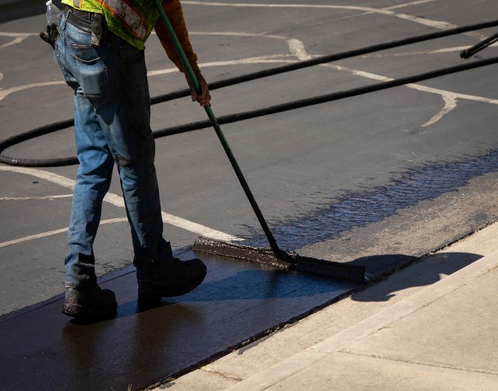 Driveways 2Day in Frederick, MD, doing autumn seal coating on a driveway