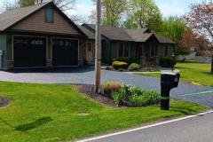 Residential driveway getting a fresh seal coating by Driveways 2Day Frederick, MD