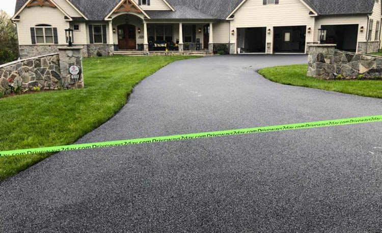 Asphalt driveway in Fredrick getting repaired by Driveways 2Day